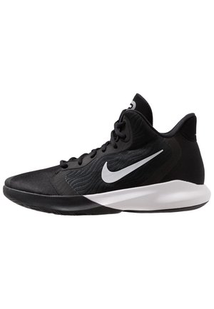 Czarny wysokostopniowy but do koszykówki Nike z białym logo Swoosh i grubą białą podeszwą, widziany z boku.