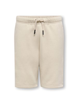 Beige Baumwollshorts mit elastischem Bund, verstellbarem Kordelzug und Seitentaschen. Glatte Textur und knielanger Schnitt.