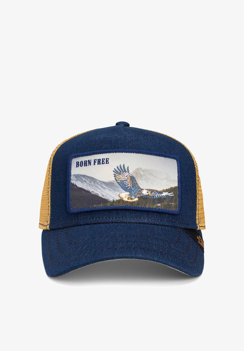 Gorra de tela azul marino con parte trasera de malla beige. Presenta un parche rectangular con un águila y el texto "NACIDO LIBRE". Visera curva, superficie texturada.