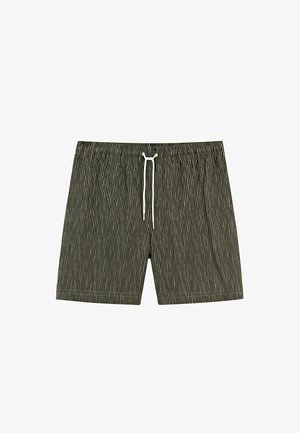 Short à rayures verticales vert foncé et noir avec une ceinture élastique et un cordon blanc à nouer au centre devant.