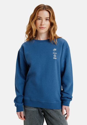 Blauwe crewneck sweatshirt van zachte stof. Voorzien van witte grafische ontwerpen, waaronder een palmboom en golven aan de voorkant. Geribbelde manchetten en zoom.