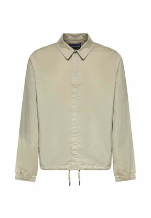 Chaqueta beige clara de manga larga con cuello, cierre delantero de botones automáticos, puños elásticos y bajo ajustable con cordón.