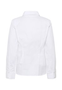 Chemise blanche à manches longues ajustée avec poignets boutonnés et col classique, vue de dos sur un fond uni.