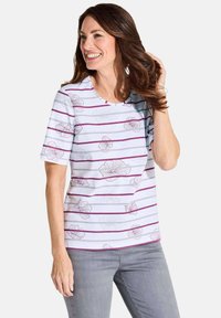 Short-sleeve, white top with purple horizontal stripes and floral outline print. Round neckline, cotton blend material, relaxed fit.
