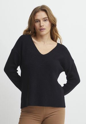 Pull en tricot côtelé noir avec un décolleté en V profond, des manches longues et une coupe décontractée. La texture est douce et le design est simple et contemporain.