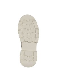 Shoe outsole in beige rubber with a textured grip pattern, featuring raised sections and a rounded toe. Size marked as 37.