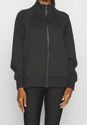 Felpa nera con zip e colletto alto, maniche con polsini a costine. Realizzata in tessuto morbido, presenta cuciture coordinate e una texture liscia.