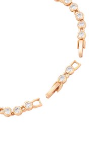 Bracciale in oro rosa con pietre trasparenti circolari, design a catena con texture liscia e chiusura sicura. Il motivo include posizionamenti alternati delle gemme.