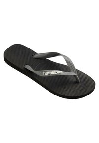 Chancla de goma negras con correas grises y suela texturizada. Logotipo "Havaianas" impreso en la correa. Diseño plano y ligero.