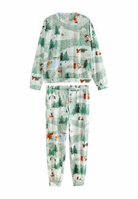 Baumwoll-Pyjama-Set mit einem Muster von winterlichen Szenen in Grün, Weiß und Rot, das Bäume, Tiere und Skilifte zeigt. Lockere Passform und elastischer Bund.