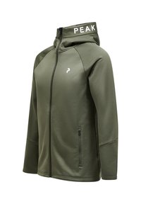 Oliven grøn zip-up hoodie med en højere krave, der har et hvidt "PEAK" logo på hætten og en lynlås-lomme på venstre side. Glat tekstur.
