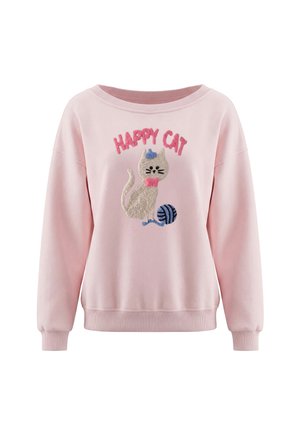Pink langærmet sweatshirt med en tekstureret grå kat, der bærer en blå hat og en pink butterfly og leger med en blå garnnøgle, tekst "HAPPY CAT" ovenover.