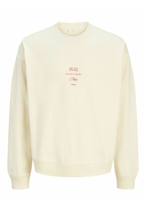Cremefarbenes Sweatshirt mit Rundhalsausschnitt und rotem Text "PALAIS des vignes et orchidées Nice 06370" zentriert auf der Brust.