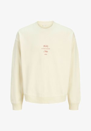 Kremfarvet crewneck sweatshirt med rød tekst "PALAIS des vignes et orchidées Nice 06370" centreret på brystet.