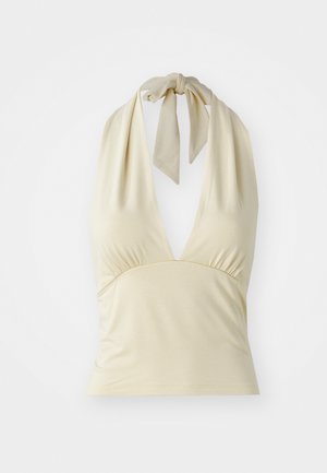 Vaalean beige halterneck-yläosa, jossa on syvä V-pääntie, rypytystä rintamuksessa ja solmittava kaulaosa. Valmistettu pehmeästä, joustavasta kankaasta.