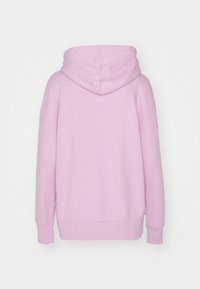 Hooded sweatshirt in light pink, featuring long sleeves, ribbed cuffs, and a relaxed fit. Smooth texture with seams visible on the back.