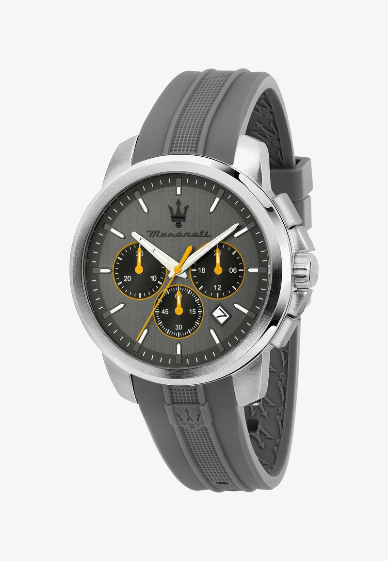 Grå silikonrem-klocka med grå urtavla, hölje av silverfärgad rostfritt stål, tre subdials och orange detaljer. Utrustad med datumfönster och texturerad rem.