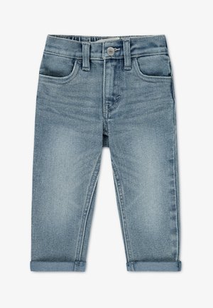 Jean en denim bleu clair coupe slim, avec cinq poches et ourlets retroussés. Comprend une fermeture par bouton et une légère décoloration.
