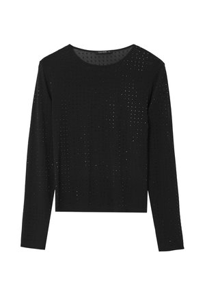 Haut noir à manches longues avec un col rond, présentant un motif texturé de petites découpes sur tout le tissu. Conception courte.