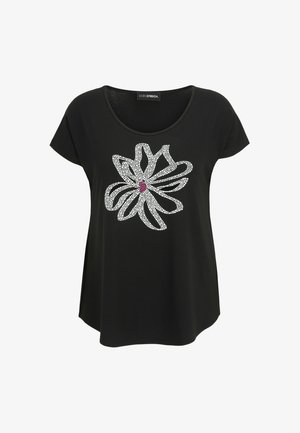 Schwarzes T-Shirt mit kurzen Ärmeln und großem weiß gepunktetem Blumenmuster sowie einem kleinen pinken Mittelpunkt auf der Vorderseite.