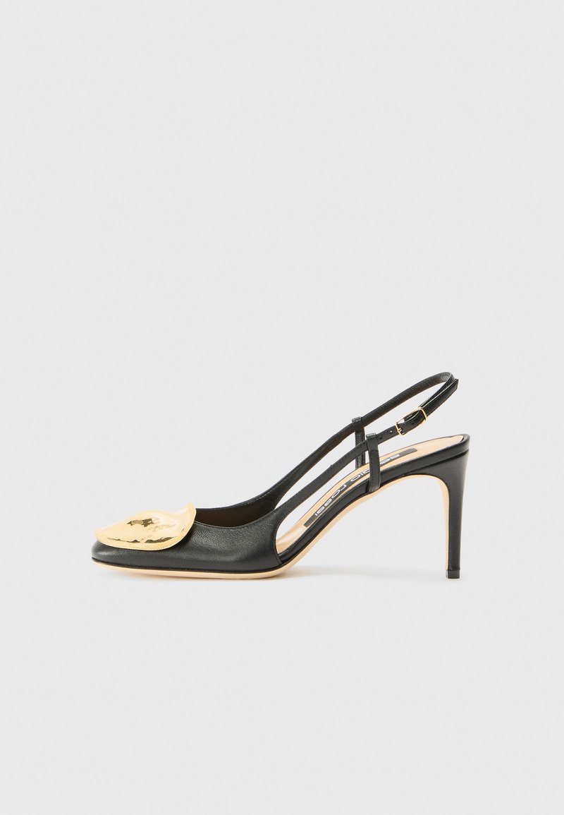 Black leather slingback high heel with a pointed toe, featuring a gold accent detail on the vamp and a slender heel.