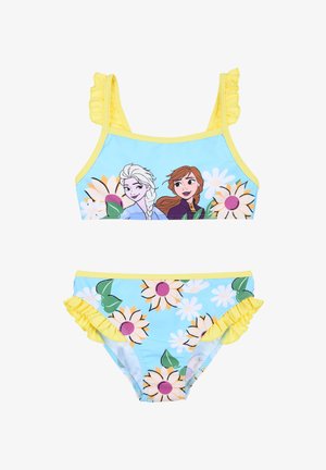 Zweiteiliger Badeanzug mit hellblauem Hintergrund, Sonnenblumenmuster und Charakteren mit fransigen gelben Akzenten an den Trägern und dem unteren Teil.