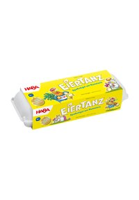 Yellow rectangular cardboard box with cartoon illustrations and text, containing art supplies. Closed with white plastic ends.