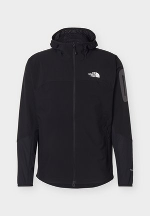 Juoda pilno užsegimo lauko striukė su gaubtu, užtrauktuku ant rankovės kišenėje ir „The North Face“ logotipu krūtinės srityje.
