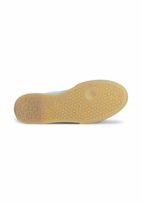 Semelle de chaussure en caoutchouc beige avec un motif texturé comportant des triangles et des cercles, conçue pour l'adhérence et la durabilité.