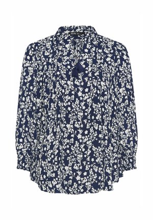 Marineblå langærmet bluse med hvidt blomsterprint, rund halsudskæring og kvastdetaljer ved fronten.