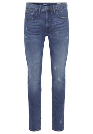 Jean en denim bleu foncé avec une coupe slim, présentant des effets usés, cinq poches et une fermeture éclair traditionnelle avec un bouton.