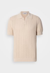 Beige knitted polo shirt with short sleeves, featuring a textured openwork pattern and a classic collar. Soft fabric and ribbed cuffs.