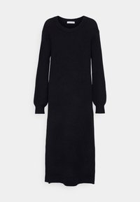 Longue robe noire en maille avec de longues manches ballon, un col rond et des poignets et un ourlet côtelés, présentée sur fond blanc.