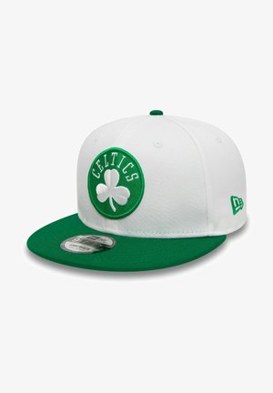 White cap with a green visor, featuring an embroidered green and white "Celtics" logo with a shamrock. Snapback design.