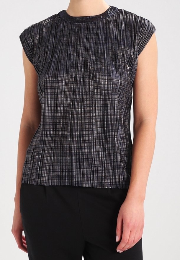 Metallic dark gray top with a textured vertical ribbed pattern, cap sleeves, and a round neckline, paired with black pants.