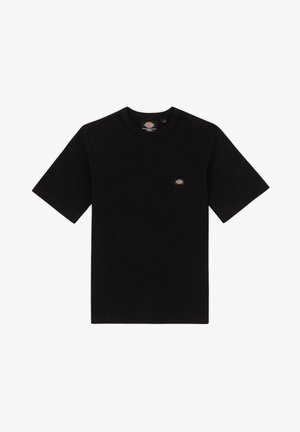 Schwarzes Baumwoll-T-Shirt mit Rundhalsausschnitt und kurzen Ärmeln. Verfügt über ein kleines, markiertes Logo auf der linken Brust. Gerade Passform.