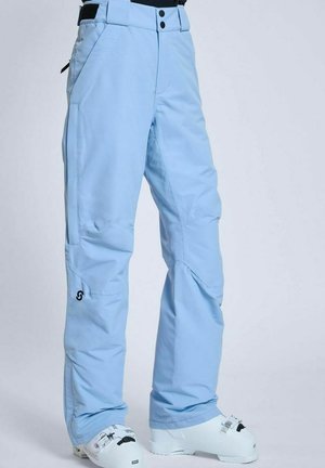 Lyseblå snebukser lavet af et slidstærkt stof. Har forstærkede knæsektioner, lynlåslommer i siden og et diskret logo på benet.