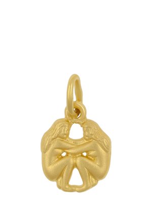 Pendentif en or montrant deux femmes assises aux longs cheveux face à face, les bras croisés et entrelacés dans un design symétrique.