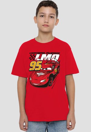 Red cotton t-shirt featuring a graphic of a cartoon race car with eyes, number 95, and "Lightning McQueen" text in bold black lettering.
