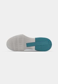 Shoe sole featuring a gray rubber base with a textured herringbone pattern, accented by a teal rectangular section on the bottom.