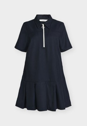 Σκούρο μπλε φόρεμα με κοντά μανίκια, γιακά και φερμουάρ στο μπροστινό μέρος. Διαθέτει φαρδύ, πτυχωτό τελείωμα για επιπλέον όγκο και κίνηση.