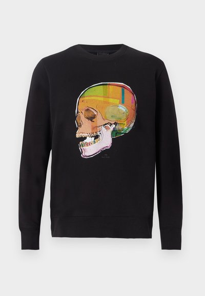 Sweat-shirt noir avec un motif graphique coloré de crâne sur le devant. Le matériau semble doux, avec des poignets et une taille côtelés.