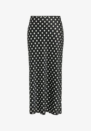 Jupe noire avec des pois blancs, fabriquée en tissu lisse. Elle possède une taille cintrée et tombe au niveau du mollet, avec une silhouette droite.