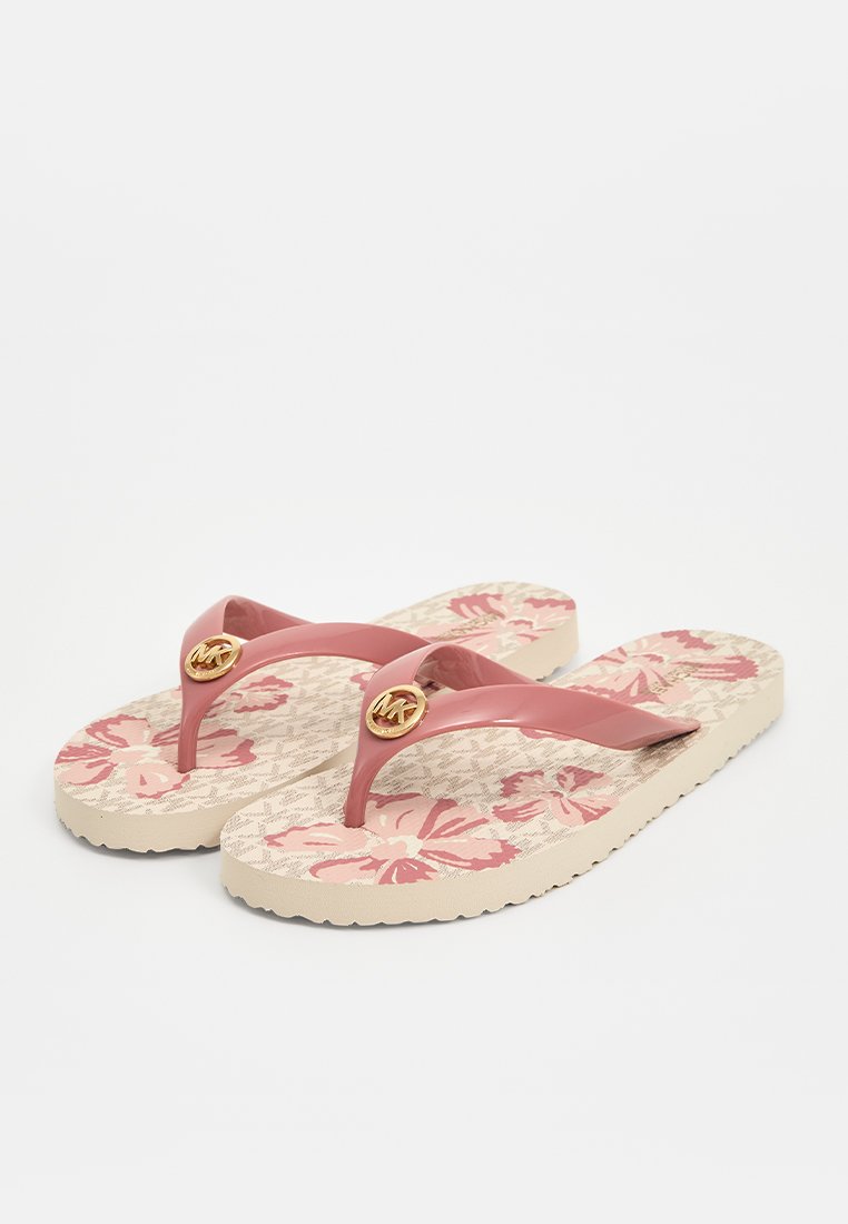 Rosa Gummisandalen mit blumigen, beigen Sohlen. Mit einem auffälligen goldenen Logo an der Kreuzung der Riemen. Strukturierter Fußbetten.
