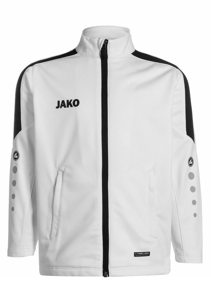 Witte jas met zwarte accenten, volledige ritssluiting aan de voorkant, zijzakken en de tekst "JAKO." Heeft een stippenpatroon op de mouwen en een ontspannen pasvorm.