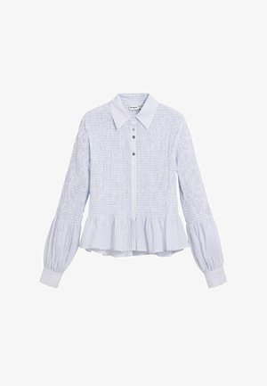 Camicia azzurro chiaro a maniche lunghe in misto cotone a trama, con collo a camicia, chiusura con bottoni sul davanti e orlo svasato e arricciato con dettagli a righe.