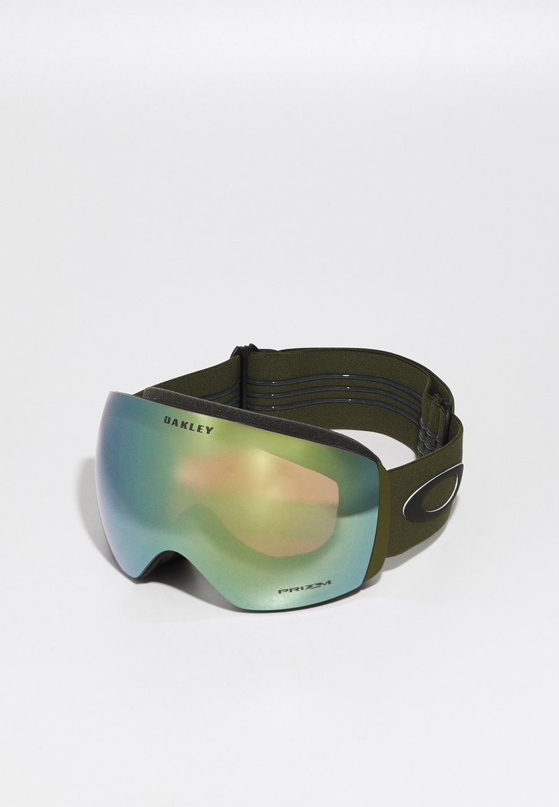 Oakley skibril met een groot, gebogen, groen getint glas, zwart frame en een olijfgroene verstelbare band. Bevat subtiele branding.