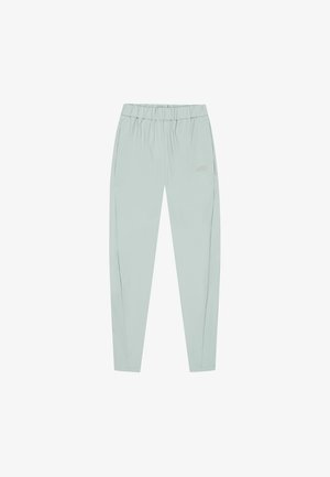 Light green athletic pants with an elastic waistband, tapered legs, and side pockets. Material appears smooth with a subtle sheen.