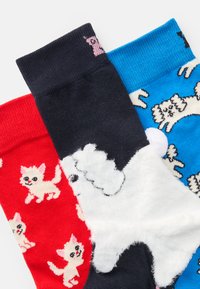 Three pairs of playful socks: red with small cats, navy with a fluffy dog pattern, and blue with playful dogs. Varied textures and colors.