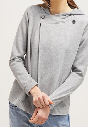 Light gray sweatshirt with a hood, featuring a diagonal overlap design and two decorative buttons on the front. Soft, textured fabric.